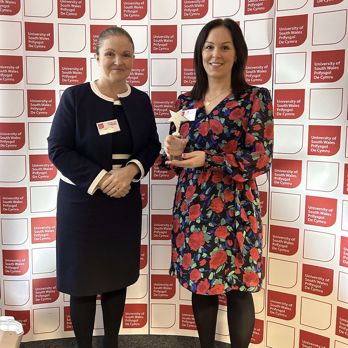 Katrina Cookson accepting Neon Events's collaboration award on their behalf